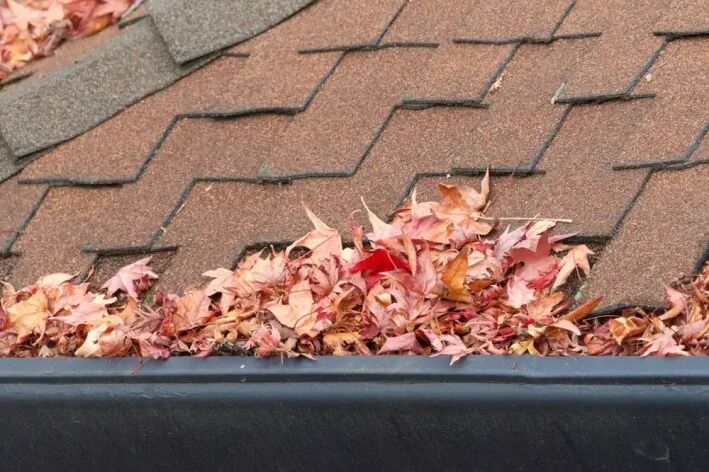 Rain,Gutters,On,Roof,Without,Gutter,Guards,,Clogged,With,Leaves, Check out our latest blog on the benefits of shurflo gutters!